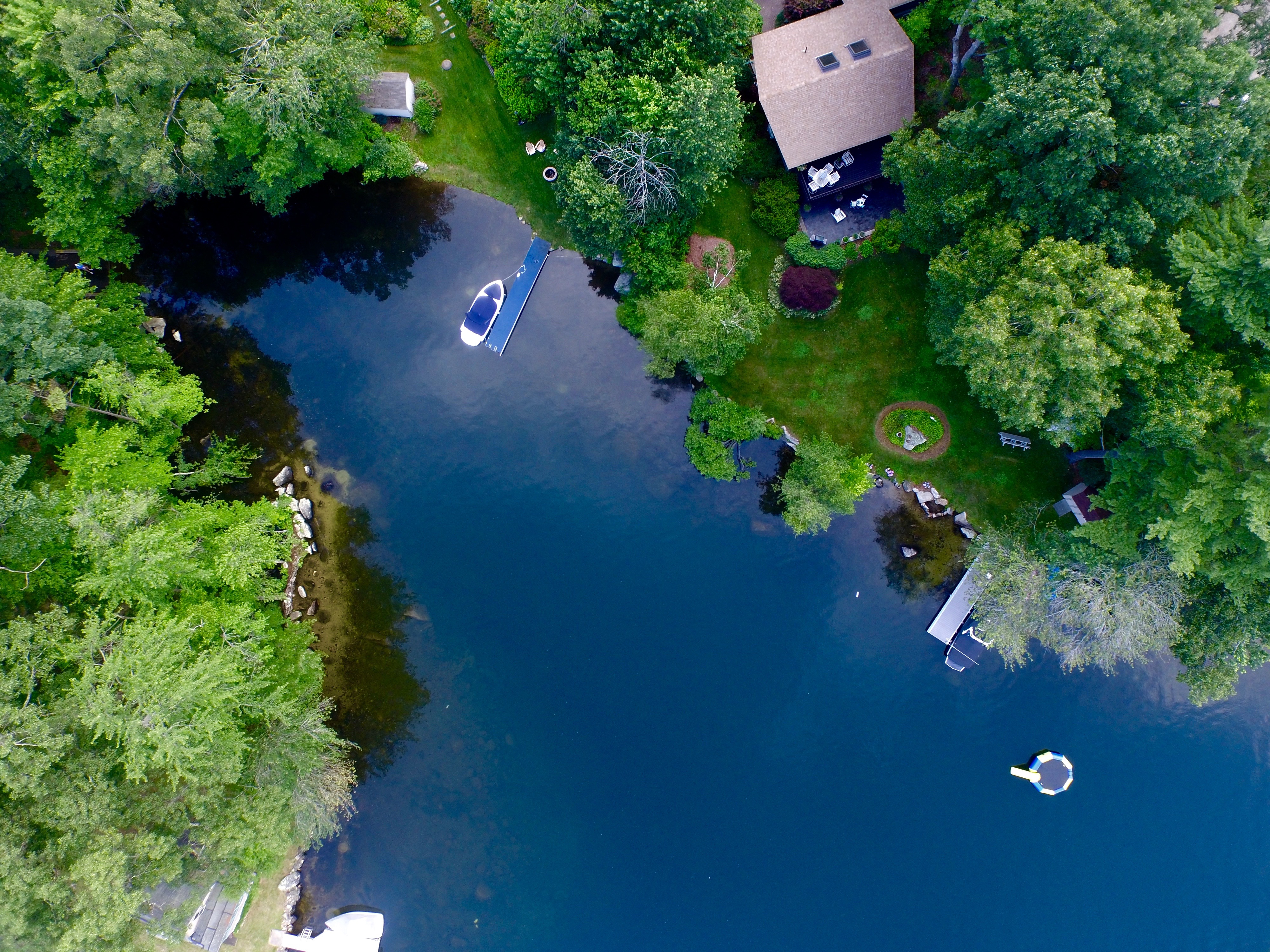 Overhead drone photo of lakehouse on Big Alum Lake, Fisdkale, MA